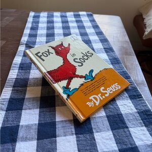 Dr. Seuss Fox in Socks Book with hard cover.